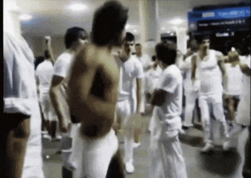 People Dancing In White Clothes GIF