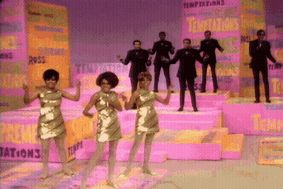 People Dancing On Stage With Temptations Behind GIF