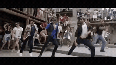 People Dancing On Street Before Crowd GIF