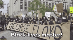 People Displaying Long Sign Saying George Floyd GIF