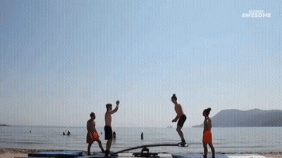 People Doing Trick On Seesaw At Beach Awesome GIF