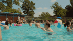 People Enjoying Summer Pool Party GIF