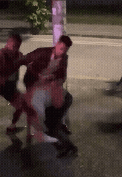 People Fighting On Street GIF