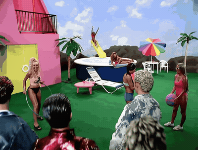 People Gathered Around Pool With Slide GIF