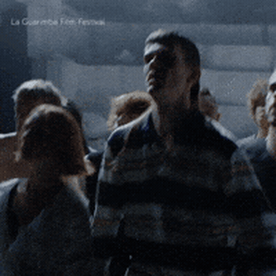 People Gathered Dark Room La Guerre Film Festival GIF