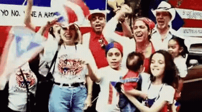 People Holding Flags And Baby By Car GIF