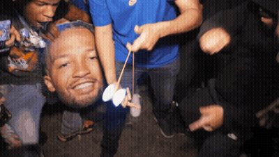 People Holding Man's Head In Air GIF