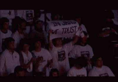 People Holding Sign In Jang We Trust GIF