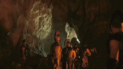 People In Cave With Helmets And Armor GIF