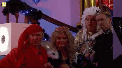 People In Costumes In Front Of TV Screen Saying TVP 1 KC GIF