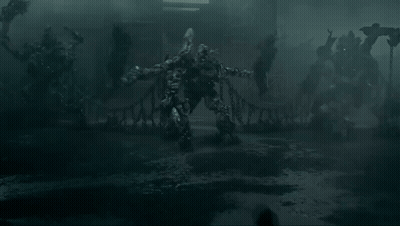 People In Dark Room Before Monster Statue GIF