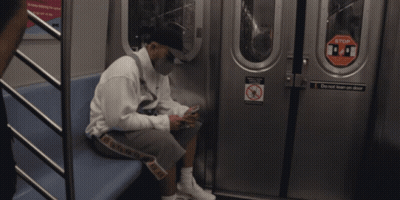 People In Dark Room With Light Through Ceiling GIF