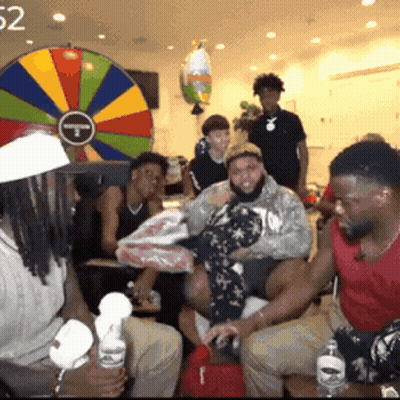 People In Front Of Colorful Spinning Wheel 52 GIF
