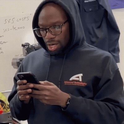 People In Front Of Rider Sign GIF