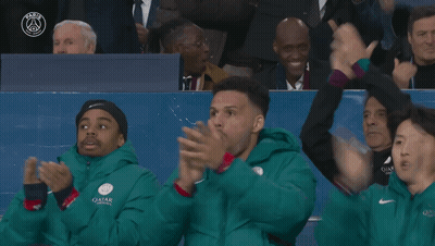 People In Green Jackets With Qatar GIF