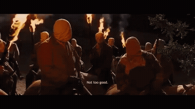 People In Masks Holding Torches Saying Not Too Good GIF