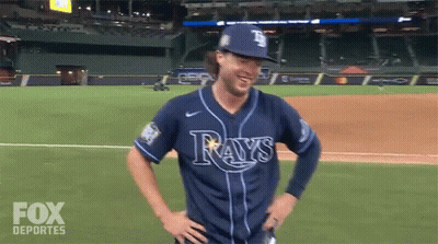 People In Rays Shirts Dancing In Crowd GIF