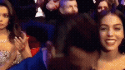 People In Stadium One Smiling At Camera GIF