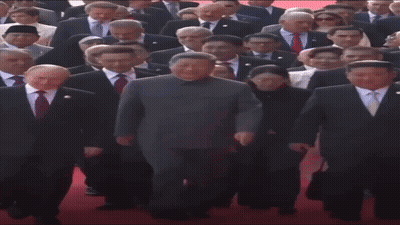 People In Suits Walking Red Carpet GIF