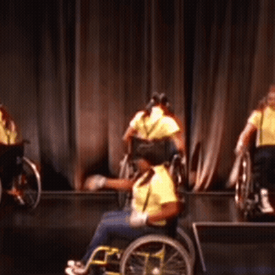 People In Wheelchairs Performing On Stage GIF