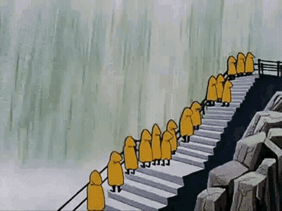 People In Yellow Raincoats On Stairs Near Waterfall GIF
