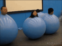 People Inside Bouncing Blue Balls