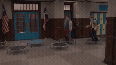 People Jumping On Trampolines In School Hallway GIF