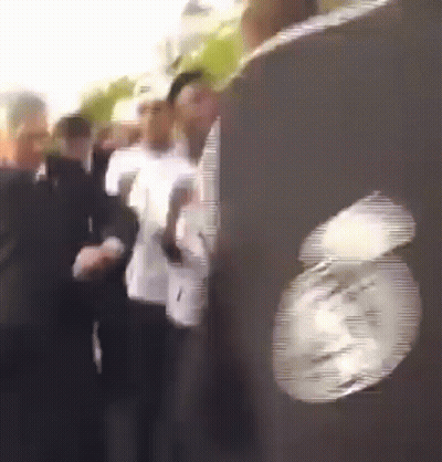 People Lined Up With Clock GIF