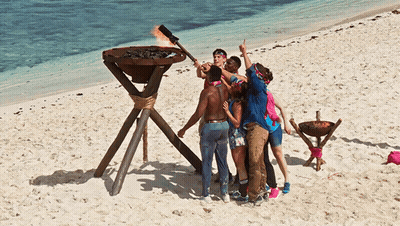People On Beach With Torch GIF