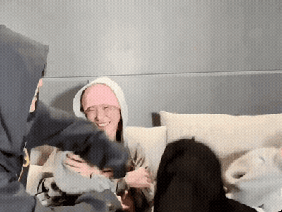 People On Couch, One In Pink Headband GIF