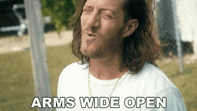 People Playing In Pool With Woman On Man's Shoulders GIF
