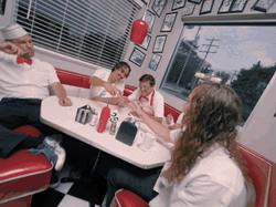 People Playing Rock Paper Scissors In Restaurant GIF