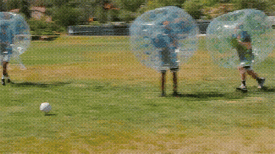 People Playing Soccer In Bubbles GIF