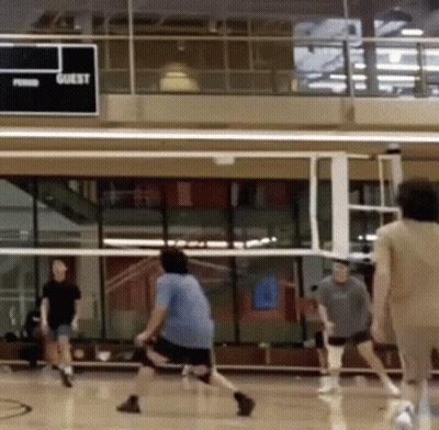 People Playing Volleyball In Gym GIF