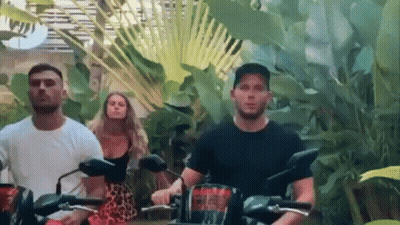 People Riding Motorcycles In Lush Green Forest GIF