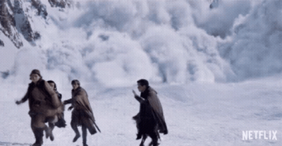People Running In Snow With Netflix Logo GIF