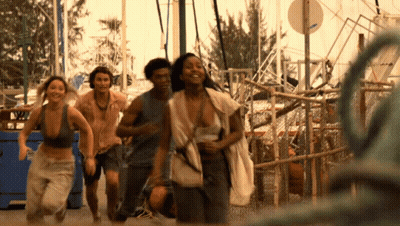People Running Past No Parking Sign GIF