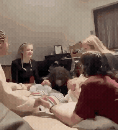 People Sitting Around Table With Dog GIF