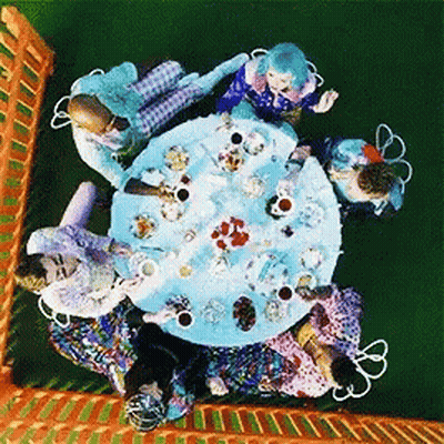 People Sitting Around Table With Food GIF