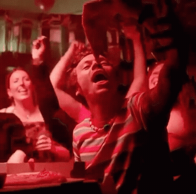 People Sitting At Table In Dark Room GIF
