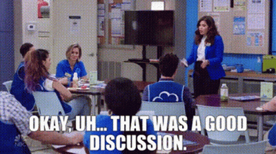 People Sitting At Tables In Classroom GIF