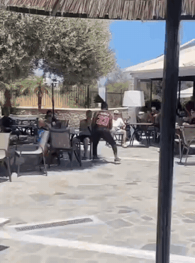 People Sitting At Tables In Restaurant GIF