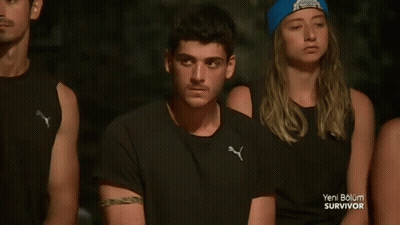 People Sitting In A Row With Blue Beanie GIF