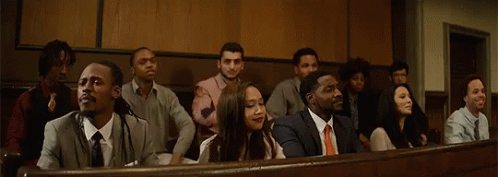 People Sitting In A Row With Hands Up GIF