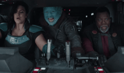 People Sitting In Car With Blue Mask GIF