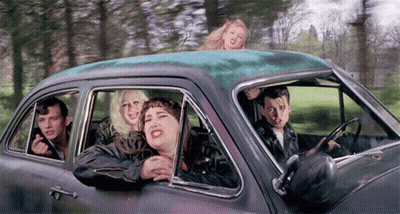 People Sitting In Car With Heads Out Window GIF