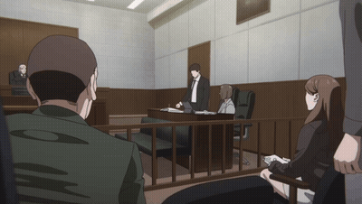 People Sitting In Courtroom Behind Fence GIF