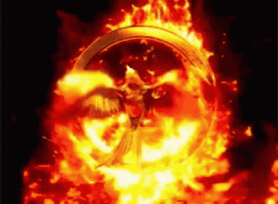 People Sitting In Dark Room With Light Through Ceiling GIF