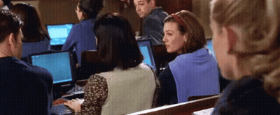 People Sitting In Lecture Hall Using Laptops GIF