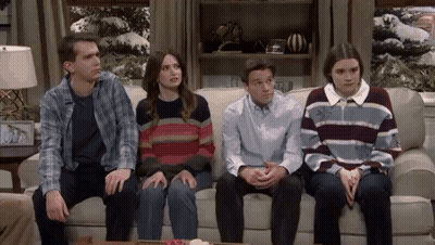 People Sitting On Couch In Living Room GIF